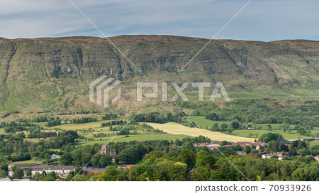 The village of Lennoxtown sitting below the Campsie Fells The village of Lennoxtown sitting below the Campsie Fells 70933926