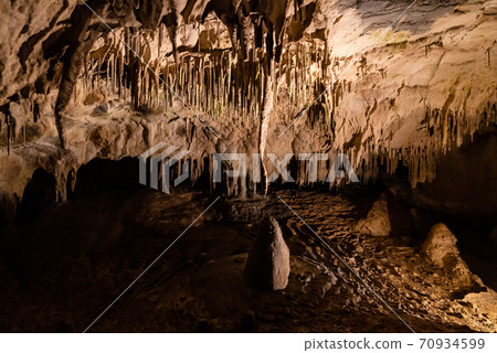 Illuminated picturesque karst rock formations in Balcarka Cave, Moravian Karst, Czech: Moravsky Kras, Czech Republic 70934599
