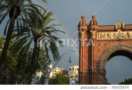 Rainbow over the Arc de Triomphe in Barcelona. Rainbow over the Arc de Triomphe in Barcelona. 70935974