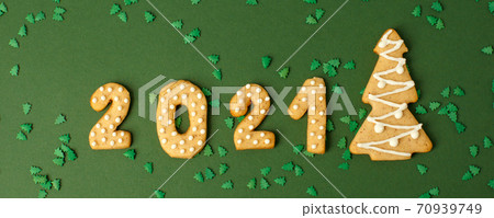 Winter Holiday banner set of gingerbread on natural green background - Number Happy New Year 2021, xmas tree with sprinkles, Merry Christmas background, trendy concept stay home, flyer, invitation Winter Holiday banner set of gingerbread on natural green background - Number Happy New Year 2021, xmas tree with sprinkles, Merry Christmas background, trendy concept stay home, flyer, invitation 70939749