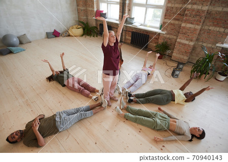 People exercising in health club People exercising in health club 70940143
