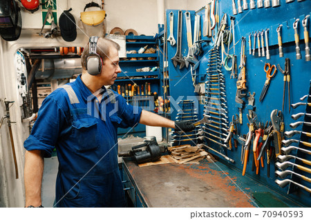 Marine engineer officer in engine control room ECR 70940593