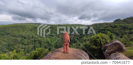 A woman in the Landscape of mountain viewpoint in Phetchabun province Thailand. A woman in the Landscape of mountain viewpoint in Phetchabun province Thailand. 70941877
