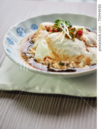 Asian food soft tofu with soy sauce 70944690