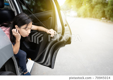 Unhappy asian child girl about to throw up from car sick or indigestion,female teenage vomiting in a car suffers from motion sickness or food poisoning,sad woman feel dizzy and nauseous from carsick Unhappy asian child girl about to throw up from car sick or indigestion,female teenage vomiting in a car suffers from motion sickness or food poisoning,sad woman feel dizzy and nauseous from carsick 70945014