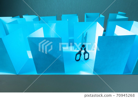 Scissors in paper labyrinth. Concept of theme of bureaucracy. 70945268