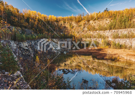 abandoned flooded quarry, Czech republic 70945968