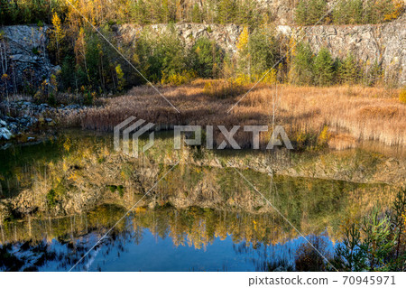 abandoned flooded quarry, Czech republic abandoned flooded quarry, Czech republic 70945971