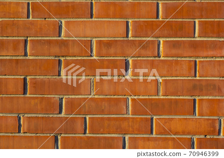 brick red wall. background of a old brick house. 70946399