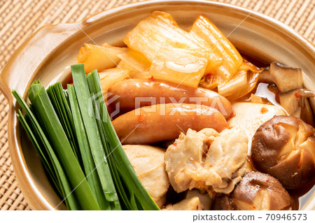 A kimchi pot in a small clay pot that is the size of a serving. A kimchi pot in a small clay pot that is the size of a serving. 70946573
