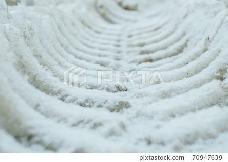frozen tractor tracks on gray snow frozen tractor tracks on gray snow 70947639