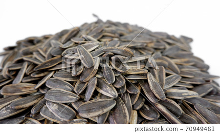 Sunflower seeds In a white background. Sunflower seeds In a white background. 70949481