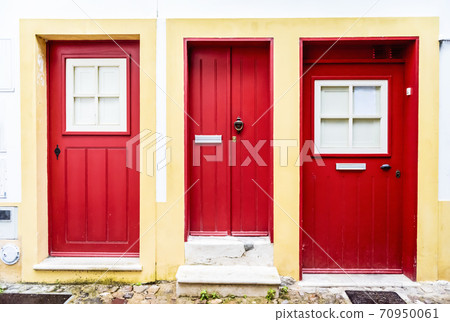 The wall of the house and doors on the street of Coimbra, Portugal 70950061