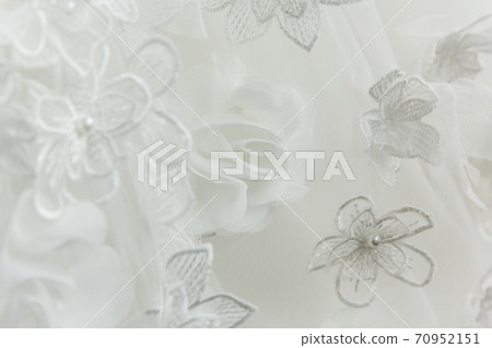 Details of the bride dress fabric and beautiful embroidery wedding concept used as a background for illustrations Details of the bride dress fabric and beautiful embroidery wedding concept used as a background for illustrations 70952151