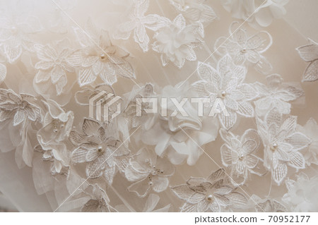 Details of the bride dress fabric and beautiful embroidery wedding concept used as a background for illustrations Details of the bride dress fabric and beautiful embroidery wedding concept used as a background for illustrations 70952177