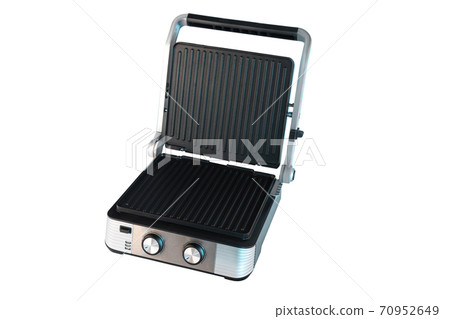 Electric grill for home cooking, burger, vegetables, meat, fish, seafood. Isolated on a white background Electric grill for home cooking, burger, vegetables, meat, fish, seafood. Isolated on a white background 70952649