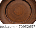 Hand-crafted empty clay plate isolated on a white background 70952657