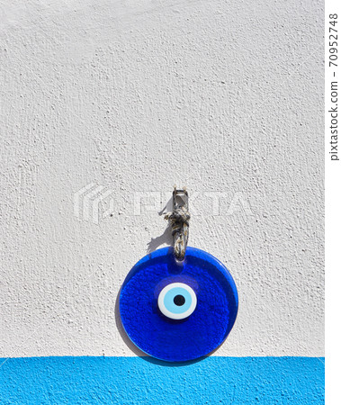 Amulet of evil eye on a wall Amulet of evil eye on a wall 70952748