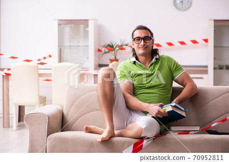 Young male student studying at home in self-isolation concept Young male student studying at home in self-isolation concept 70952811