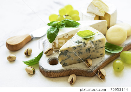 Various types of cheese and snacks 70953144