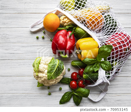 Fresh vegetables and fruits on eco string bag  70953145