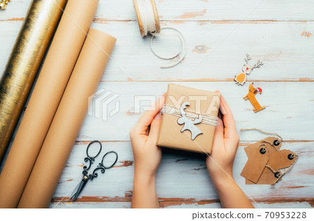 Gift wrapping process, preparation for Xmas 70953228