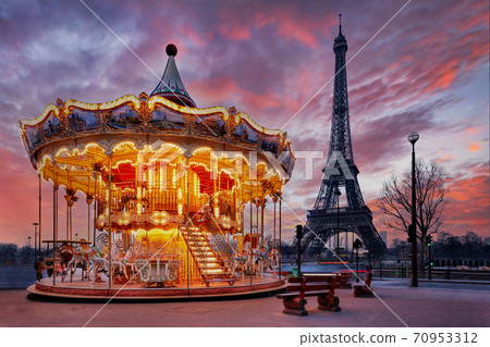 sunset over vintage carousel close to Eiffel Tower, Paris 70953312