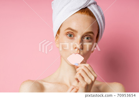 Portrait of lovely lady with naked shoulders isolated on pink background 70953654