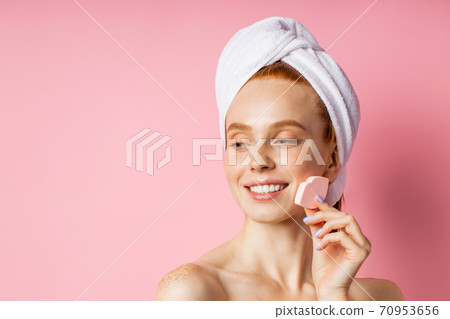 Portrait of lovely lady with naked shoulders isolated on pink background 70953656