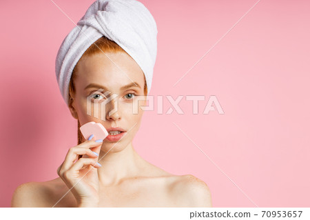 Portrait of lovely lady with naked shoulders isolated on pink background 70953657