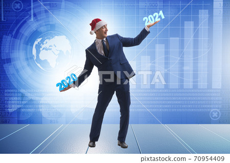 Concept of businessman in transition from 2020 to 2021 Concept of businessman in transition from 2020 to 2021 70954409