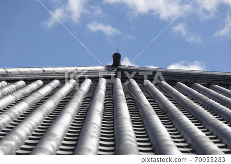 Roof tile and blue sky Roof tile and blue sky 70955283