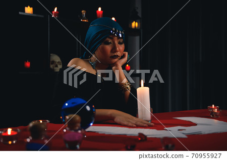 Fortune teller reading tarot card to predict fate or destiny. Fortune teller reading tarot card to predict fate or destiny. 70955927
