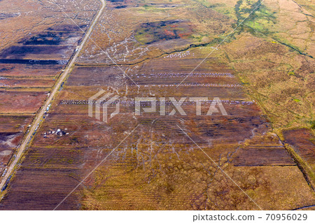 Aerial view of peat cutting aerial is Donegal - Ireland Aerial view of peat cutting aerial is Donegal - Ireland 70956029