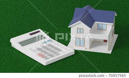 Toy house and calculator placed on a flat surface 70957565