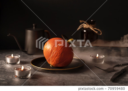 Vintage template with old metal tableware, ripe pumpkin and ear of wheat on black stone background for concept design. Fall concept. 70959480
