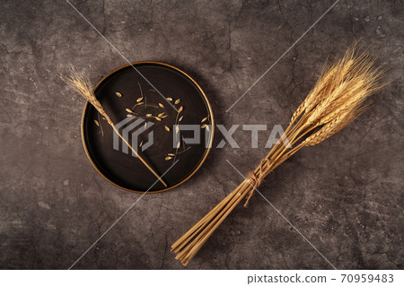 Vintage template with ear of wheat on black stone background for concept design. Flat lay style. 70959483
