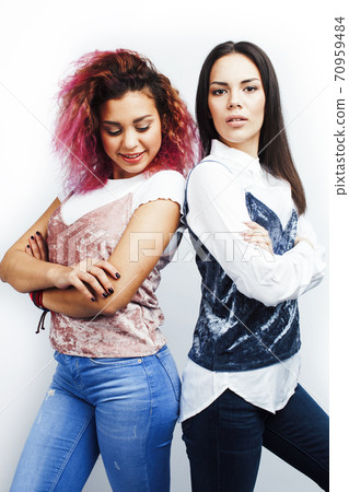 best friends diverse races teenage girls together having fun, asian and african , posing emotional on white background, lifestyle people concept 70959484