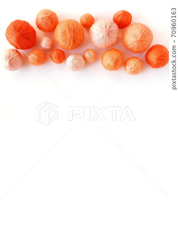 Orange balls of yarn isolated on white background. 70960163