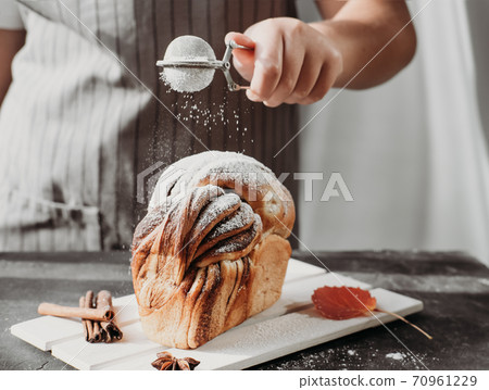 artisan sourdough cinnamon swirl bread on wooden rack 70961229
