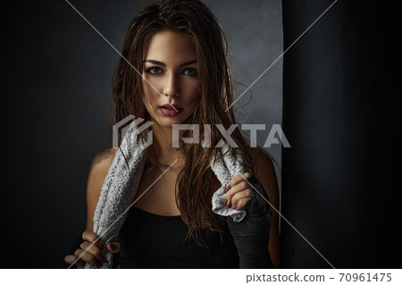 sporty woman in black boxing gloves sporty woman in black boxing gloves 70961475