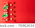 Christmas background, Christmas box with red ribbon and green ribbon, red ball and gold star on red background. Christmas background and Happy New Year for background 70962634