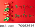 Christmas background, Christmas box with red ribbon and green ribbon, red ball and gold star on red background. Christmas background and Happy New Year for background 70962636