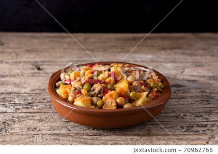 Ropa vieja in crock pot on wooden table Ropa vieja in crock pot on wooden table 70962768