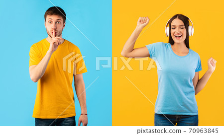 Man making hush sign, woman listening to music Man making hush sign, woman listening to music 70963845