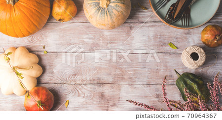 Thanksgiving dinner background with pumpkins Thanksgiving dinner background with pumpkins 70964367