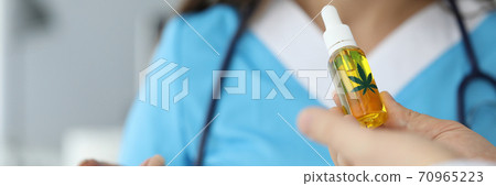 Doctor holding bottle with cbd Doctor holding bottle with cbd 70965223