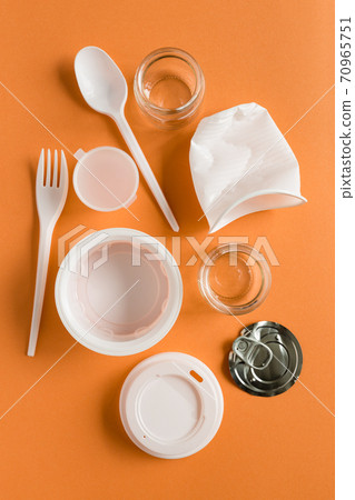 Secondary raw, plastic things for processing or recycling flat lay on the blue background. Separate waste. Problem of environmental pollution. Secondary raw, plastic things for processing or recycling flat lay on the blue background. Separate waste. Problem of environmental pollution. 70965751