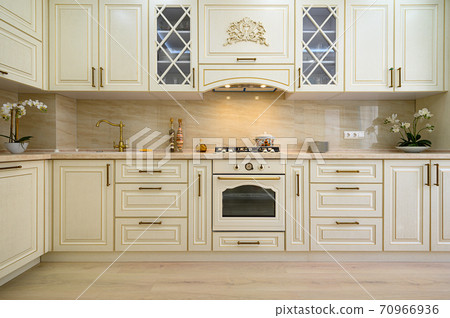 Beige furniture at kitchen in provence style, front view Beige furniture at kitchen in provence style, front view 70966936