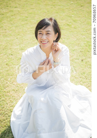A refreshing middle-aged senior woman enjoying Yokohama Yamashita Park 70968657